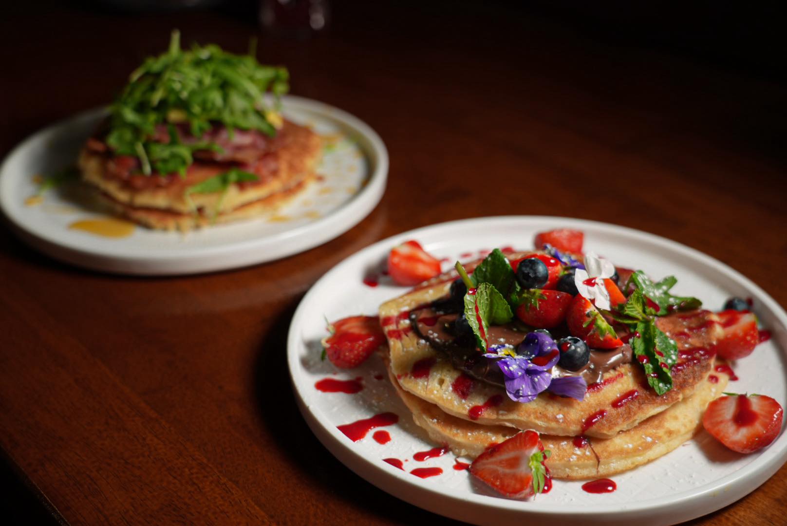 Pancakes served with berries at The Little Merchant